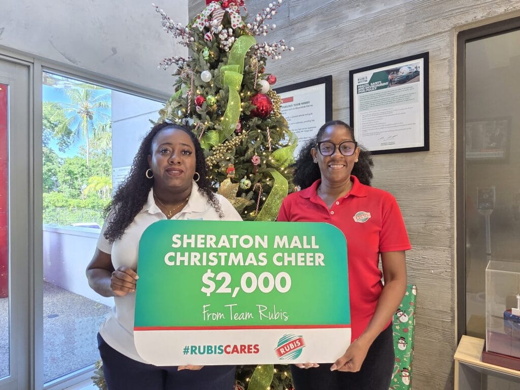 Karen Oliver, Head of Business Operations, Sheraton Mall (left), with Mechell Warner, Marketing Coordinator, RUBIS, at the donation presentation.
