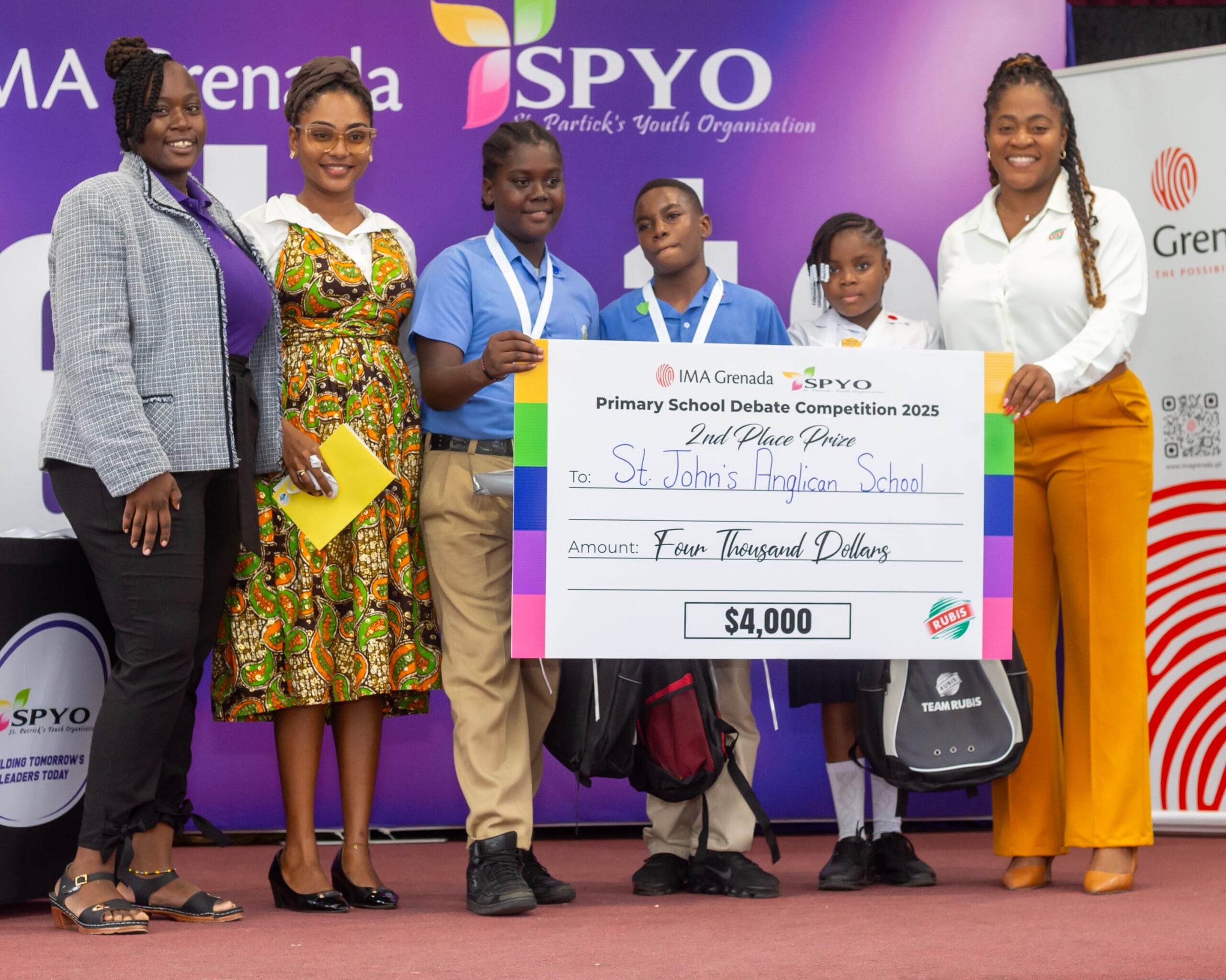 RUBIS Accounts Executive Areen Lewis (right) with the elated members of the second-place St. John’s Anglican School